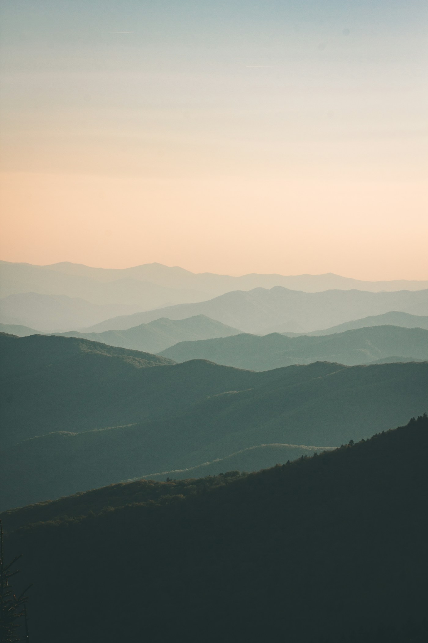 Layered mountains at sunrise